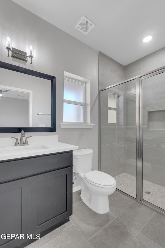 1445 Summer Storm Pl, El Paso, TX 79928 - full bath featuring vanity, toilet, a stall shower, tile patterned flooring, and baseboards