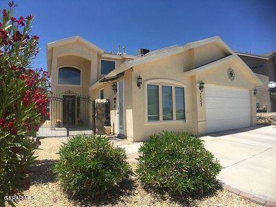 11353 W Ranch Ct NE, El Paso, TX 79934 - view of front of home with a garage, stucco siding, and driveway