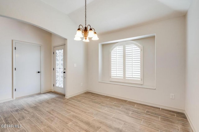 13833 Sky Harbor Ave, Horizon City, TX 79928 - empty room featuring a chandelier and light wood-type flooring