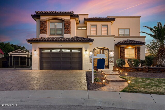 3081 Coyote Point Pl, El Paso, TX 79938 - mediterranean / spanish house with stucco siding, decorative driveway, and a tile roof