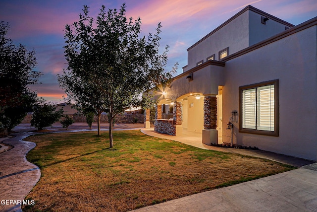 3081 Coyote Point Pl, El Paso, TX 79938 - yard at dusk featuring a yard