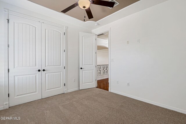 3081 Coyote Point Pl, El Paso, TX 79938 - unfurnished bedroom with carpet, a closet, and a ceiling fan
