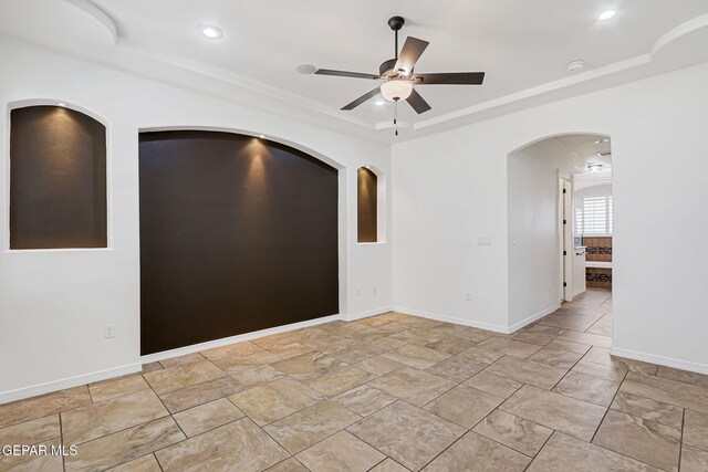 3081 Coyote Point Pl, El Paso, TX 79938 - spare room with a tray ceiling, a ceiling fan, recessed lighting, arched walkways, and a smoke detector