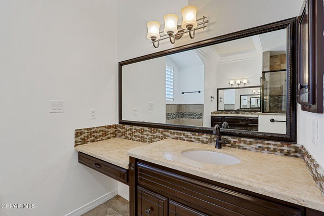 3081 Coyote Point Pl, El Paso, TX 79938 - bathroom featuring a chandelier, decorative backsplash, a stall shower, vanity, and tile patterned floors