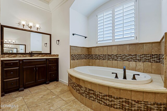 3081 Coyote Point Pl, El Paso, TX 79938 - bathroom featuring vanity, a garden tub, tile patterned floors, and vaulted ceiling