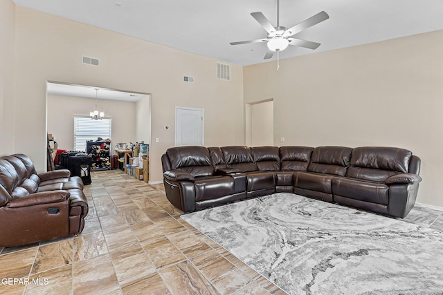 11589 Flor Cadillo, Socorro, TX 79927 - living area featuring ceiling fan, a chandelier, and a high ceiling