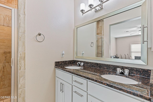 11589 Flor Cadillo, Socorro, TX 79927 - bathroom featuring double vanity and a stall shower