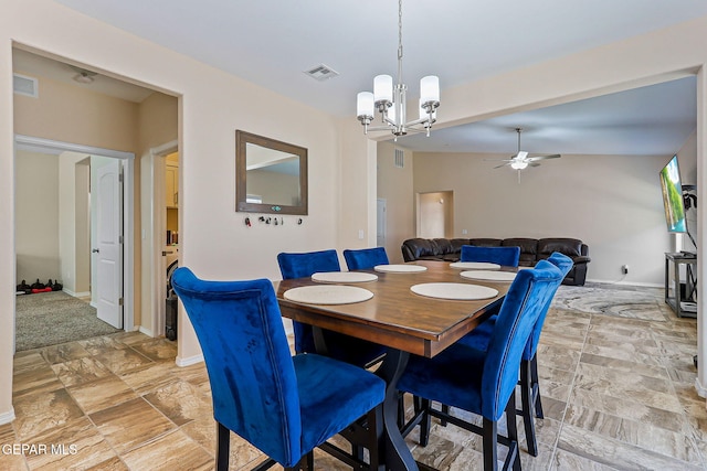 11589 Flor Cadillo, Socorro, TX 79927 - dining area with a chandelier, a ceiling fan, and baseboards