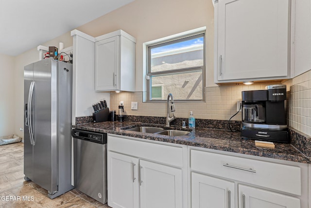 11589 Flor Cadillo, Socorro, TX 79927 - kitchen with appliances with stainless steel finishes, a sink, white cabinets, backsplash, and dark stone counters