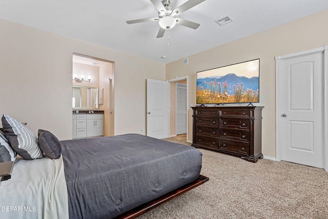 11589 Flor Cadillo, Socorro, TX 79927 - carpeted bedroom with ensuite bath and a ceiling fan