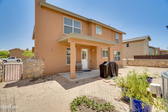 13261 Walker Post Ave, El Paso, TX 79928 - rear view of property with stucco siding and a patio