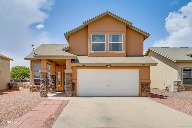13261 Walker Post Ave, El Paso, TX 79928 - view of front of home featuring stone siding, stucco siding, a garage, concrete driveway, and roof with shingles