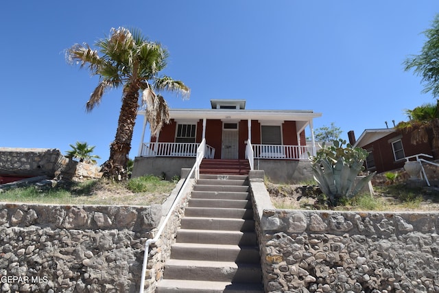 1275 Prospect St, El Paso, TX 79902 - view of front of house with a porch and stairway