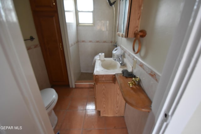 1275 Prospect St, El Paso, TX 79902 - bathroom with toilet, vanity, tile patterned flooring, and a shower