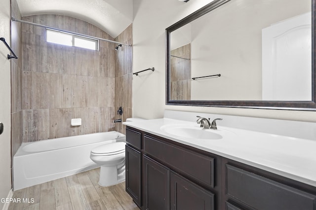 14391 Loma Esmeralda, El Paso, TX 79938 - full bathroom featuring vanity, shower / tub combination, wood finished floors, and vaulted ceiling