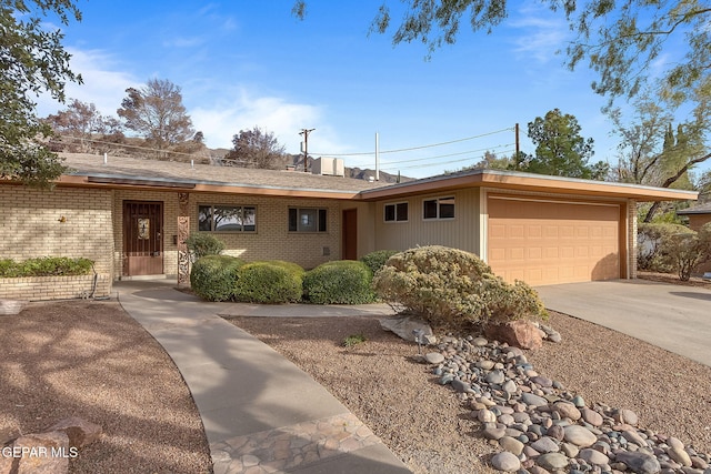 408 Spring Hill Cir, El Paso, TX 79912 - ranch-style house featuring an attached garage, brick siding, and concrete driveway
