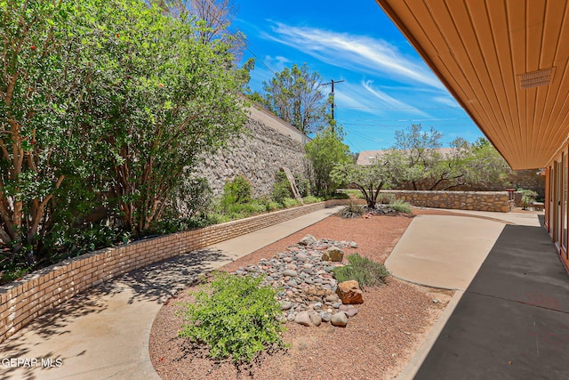 408 Spring Hill Cir, El Paso, TX 79912 - fenced backyard with a patio area