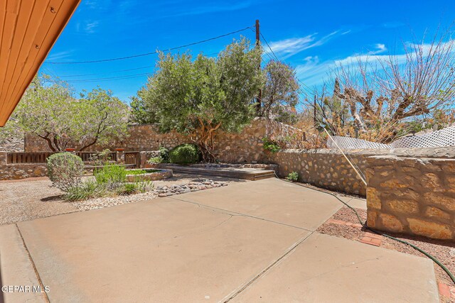 408 Spring Hill Cir, El Paso, TX 79912 - fenced backyard featuring a patio area