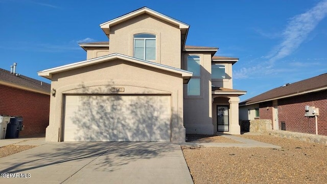 3541 Al Roberts Dr, El Paso, TX 79936 - view of front facade with stucco siding, driveway, and an attached garage