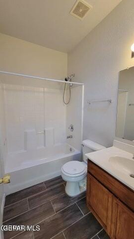 3541 Al Roberts Dr, El Paso, TX 79936 - full bath featuring vanity, tub / shower combination, and toilet