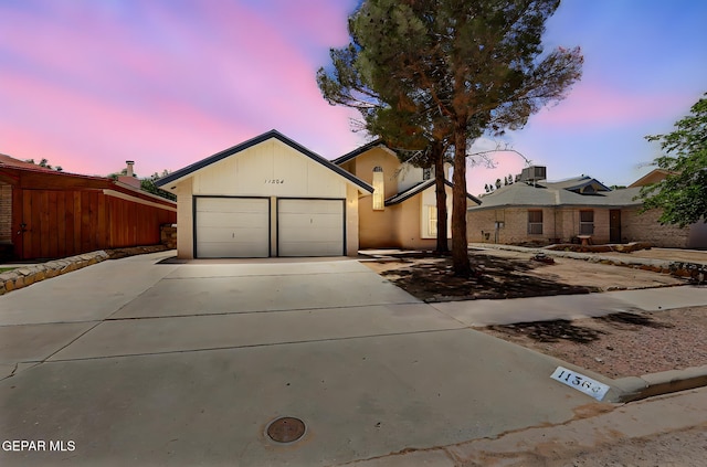 11364 Crater Lake Ave, El Paso, TX 79936 - ranch-style home featuring concrete driveway and an attached garage