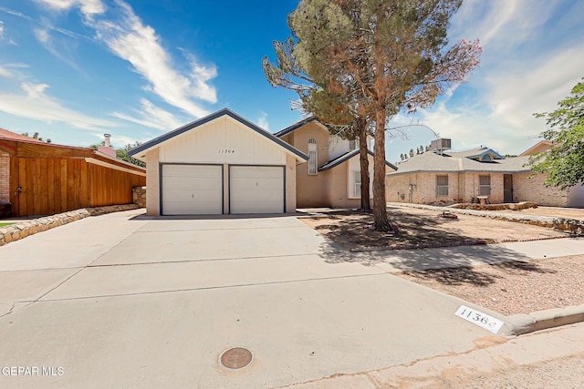 11364 Crater Lake Ave, El Paso, TX 79936 - view of front of home with driveway and a garage