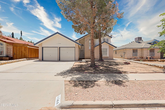 11364 Crater Lake Ave, El Paso, TX 79936 - view of front of house featuring driveway and an attached garage