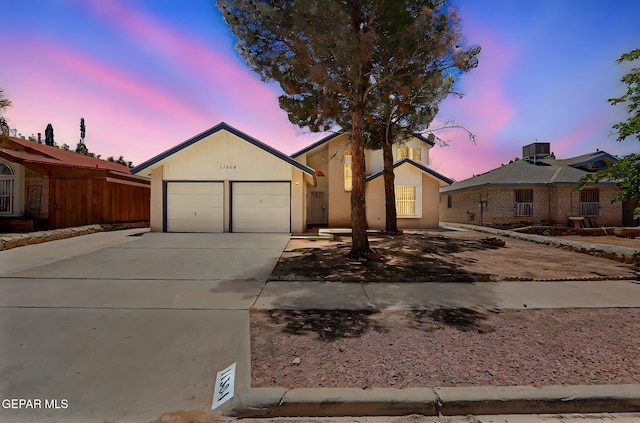 11364 Crater Lake Ave, El Paso, TX 79936 - view of front of property with driveway, an attached garage, and stucco siding