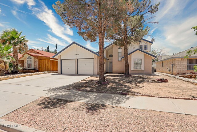 11364 Crater Lake Ave, El Paso, TX 79936 - view of front of house featuring driveway and a garage