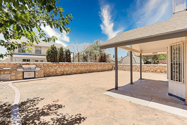 11364 Crater Lake Ave, El Paso, TX 79936 - fenced backyard featuring a patio area
