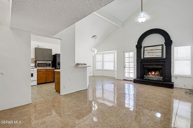 11364 Crater Lake Ave, El Paso, TX 79936 - unfurnished living room featuring high vaulted ceiling, a brick fireplace, a textured ceiling, beam ceiling, and light tile patterned flooring