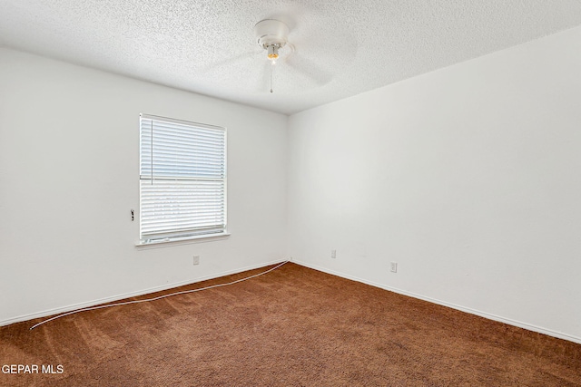 11364 Crater Lake Ave, El Paso, TX 79936 - unfurnished room featuring dark colored carpet, ceiling fan, a textured ceiling, and baseboards
