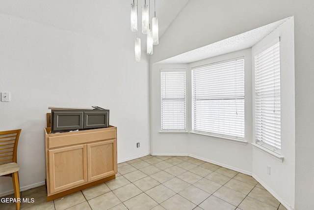 11364 Crater Lake Ave, El Paso, TX 79936 - unfurnished dining area featuring plenty of natural light, baseboards, and light tile patterned floors