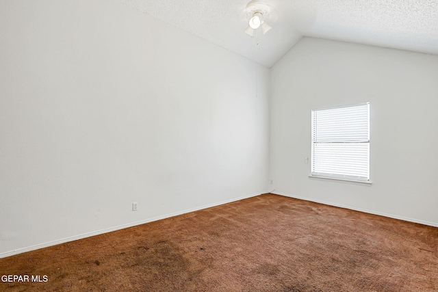 11364 Crater Lake Ave, El Paso, TX 79936 - carpeted spare room featuring lofted ceiling, a ceiling fan, baseboards, and a textured ceiling