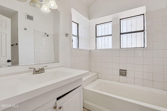 11364 Crater Lake Ave, El Paso, TX 79936 - bathroom with a bathtub and vanity