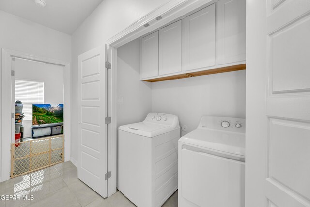 14423 Kayla Mia Dr, El Paso, TX 79938 - laundry room featuring cabinet space, washer and dryer, and light tile patterned floors
