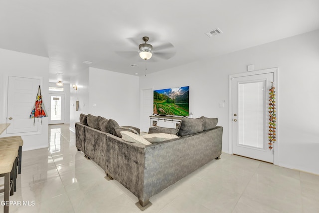 14423 Kayla Mia Dr, El Paso, TX 79938 - living room with a ceiling fan, light tile patterned flooring, and baseboards