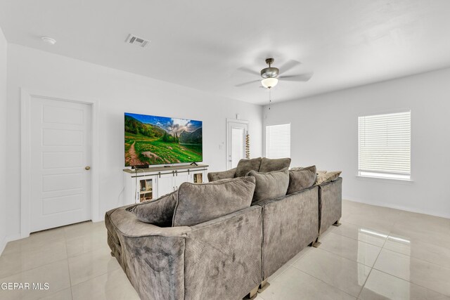 14423 Kayla Mia Dr, El Paso, TX 79938 - living room featuring light tile patterned flooring, healthy amount of natural light, and a ceiling fan