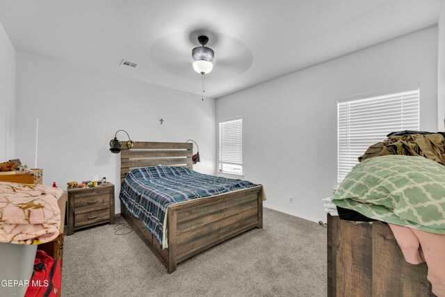 14423 Kayla Mia Dr, El Paso, TX 79938 - bedroom with light colored carpet, baseboards, and a ceiling fan