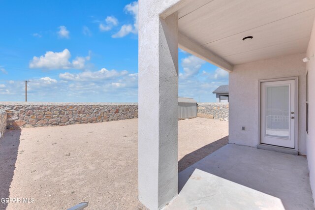 14423 Kayla Mia Dr, El Paso, TX 79938 - fenced backyard with a patio area