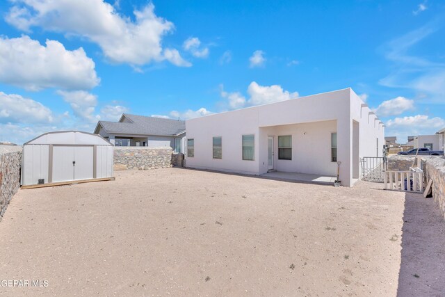 14423 Kayla Mia Dr, El Paso, TX 79938 - rear view of property featuring stucco siding, a fenced backyard, and a patio area