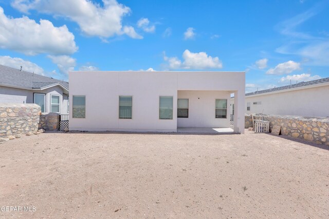 14423 Kayla Mia Dr, El Paso, TX 79938 - back of property with stucco siding and a patio