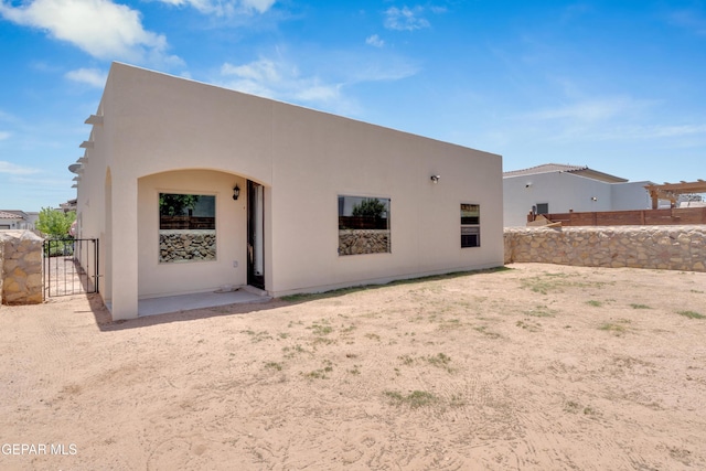 14901 Ted Banks Ave, El Paso, TX 79938 - back of house featuring a gate and stucco siding