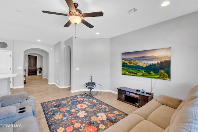 14901 Ted Banks Ave, El Paso, TX 79938 - living area featuring arched walkways, a ceiling fan, light wood finished floors, and recessed lighting