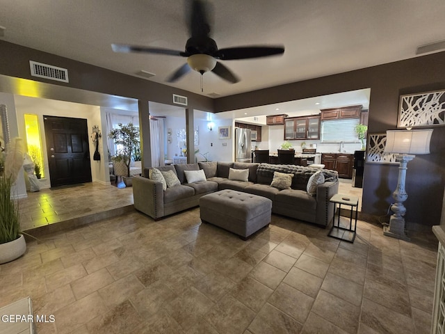 7000 Armistad Ave, El Paso, TX 79912 - living area with ceiling fan and stone finish floors