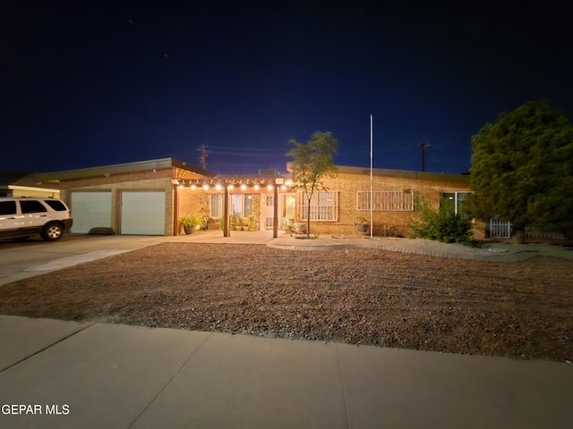 7000 Armistad Ave, El Paso, TX 79912 - view of front of property featuring a garage and driveway