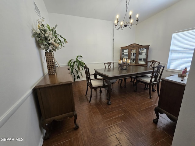 7000 Armistad Ave, El Paso, TX 79912 - dining space with a chandelier and baseboards