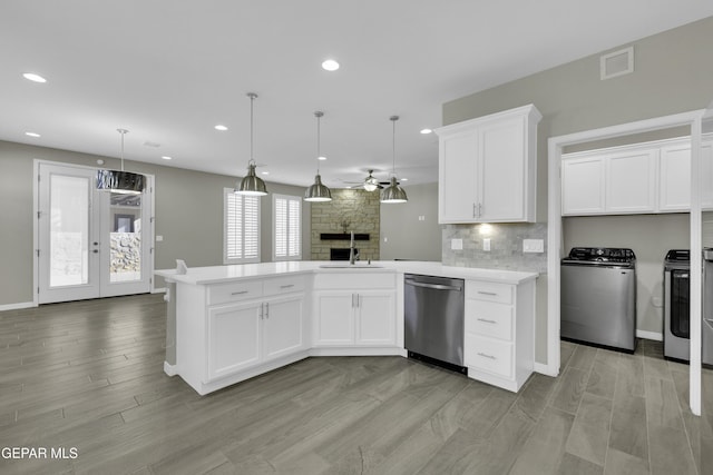 912 Malven Pl, El Paso, TX 79928 - kitchen with dishwasher, a peninsula, a ceiling fan, light countertops, and open floor plan