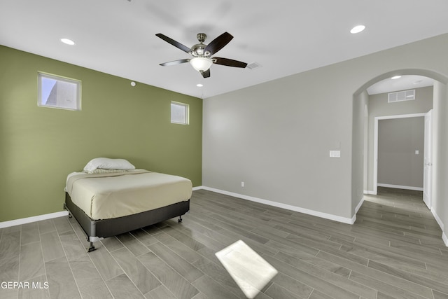 912 Malven Pl, El Paso, TX 79928 - bedroom featuring arched walkways, recessed lighting, ceiling fan, and wood finished floors