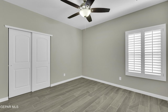 912 Malven Pl, El Paso, TX 79928 - unfurnished bedroom featuring wood tiled floors, a closet, and ceiling fan